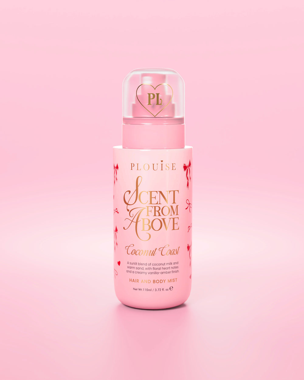 Pink bottle of 'Scent From Above' hair and body mist with red bow graphics against a pink background