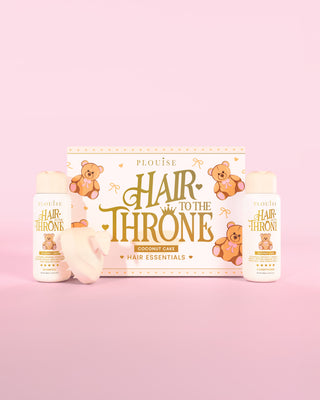 P.Louise Hair to the Throne -hiussetti, jossa on kookoskakkushampoo, hoitoaine ja päänahan hierontalaite vaaleanpunaisella taustalla