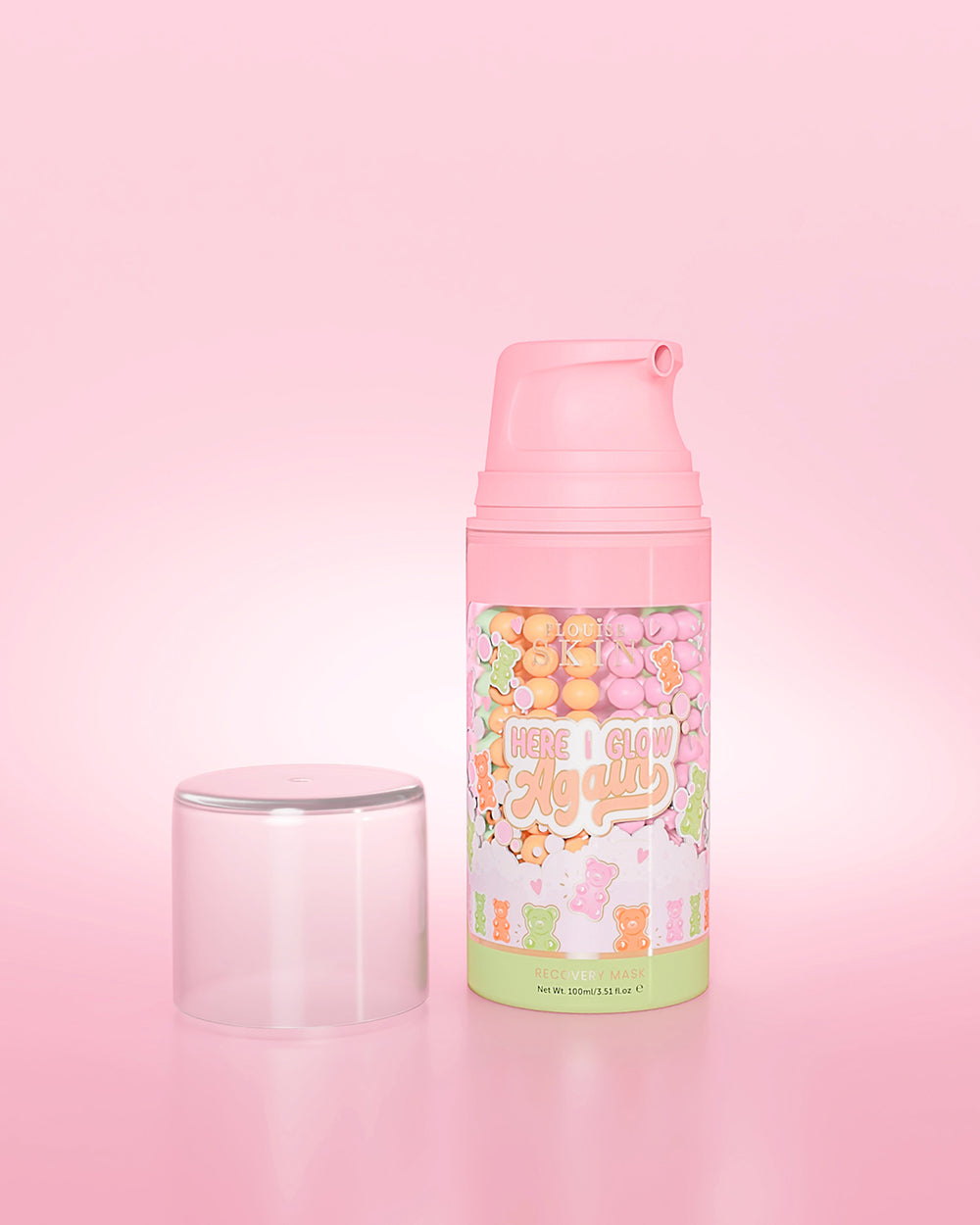 Fialová lahvička P. Louise Here I Glow Again Candy Bears Recovery Mask na růžovém pozadí